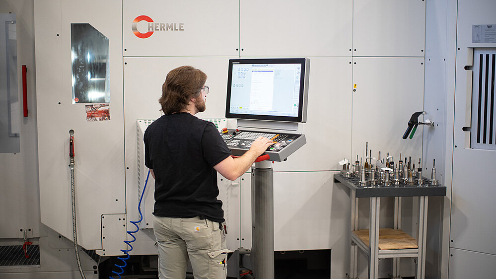STIWA US CNC Operator, Jacob Anglin, reviews program setup on the HERMLE C 42 with RS 2 automation.